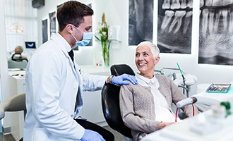 Dental implant consultation between female patient and dentist