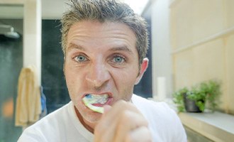 Man brushing his teeth