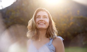 Woman smiling outside