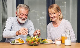 a mature couple enjoying a healthy meal